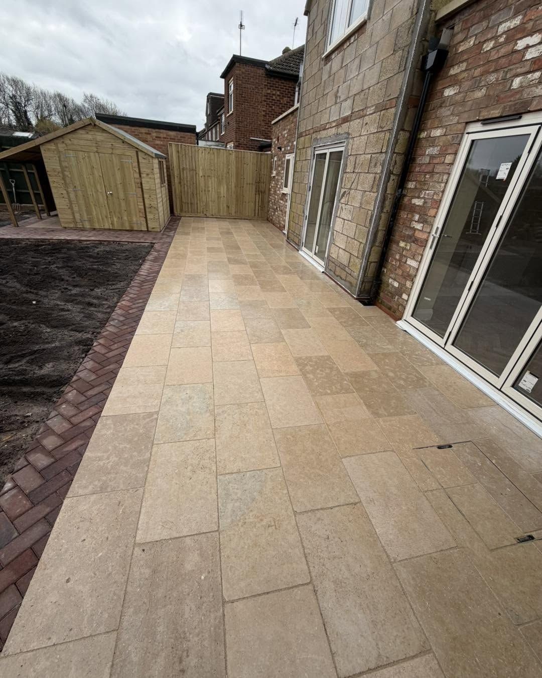 Sandstone patio path along house